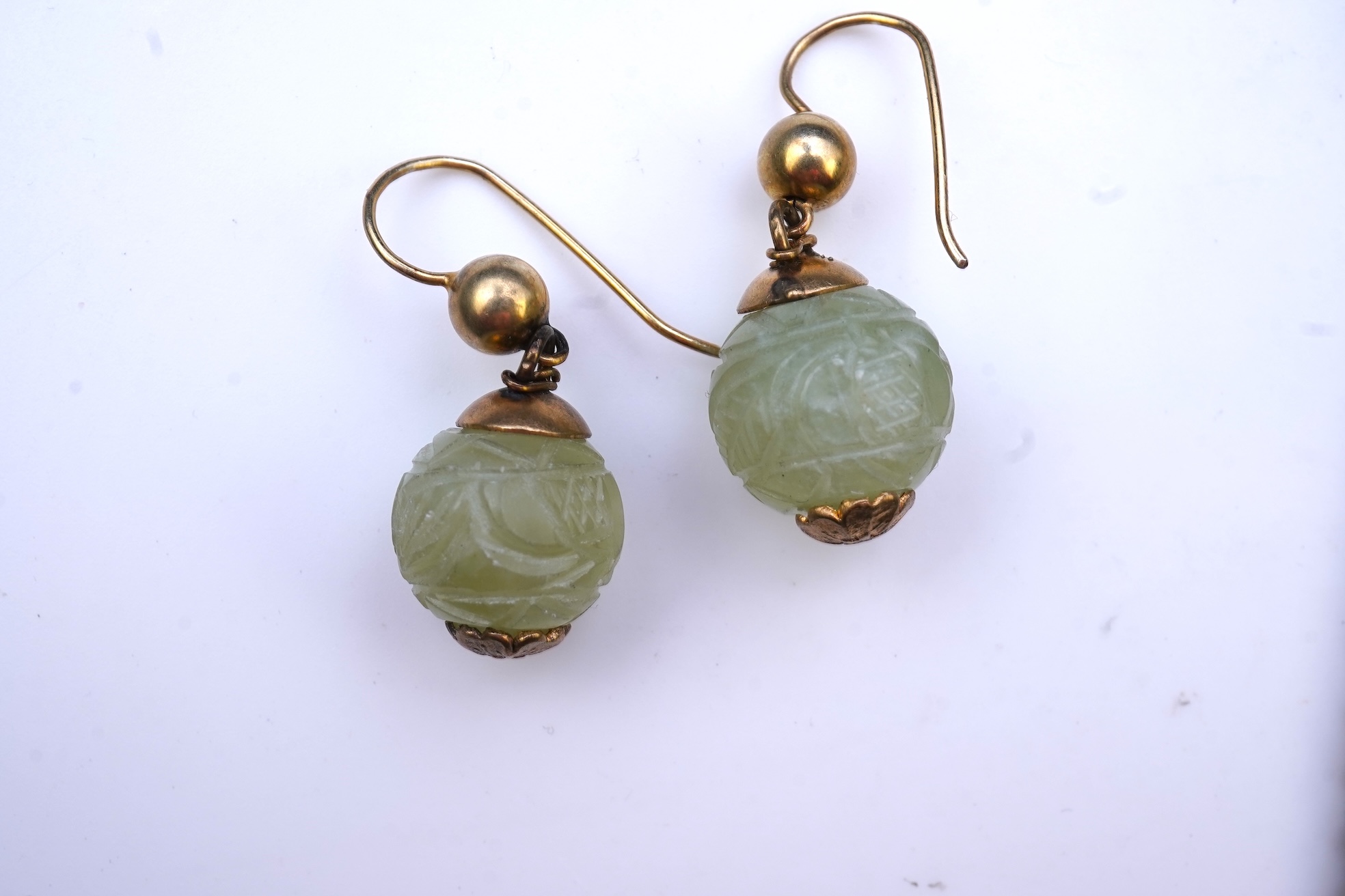 A chatelaine and a pair of serpentine bead earrings